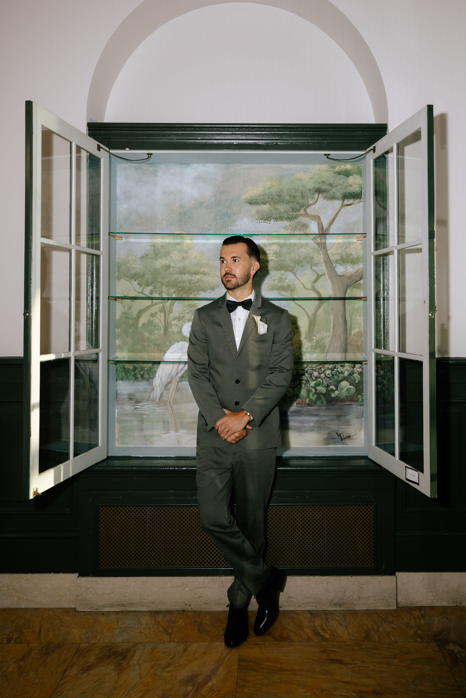 Elegant groom posing for a bridal portrait at New College in Sarasota, Florida.