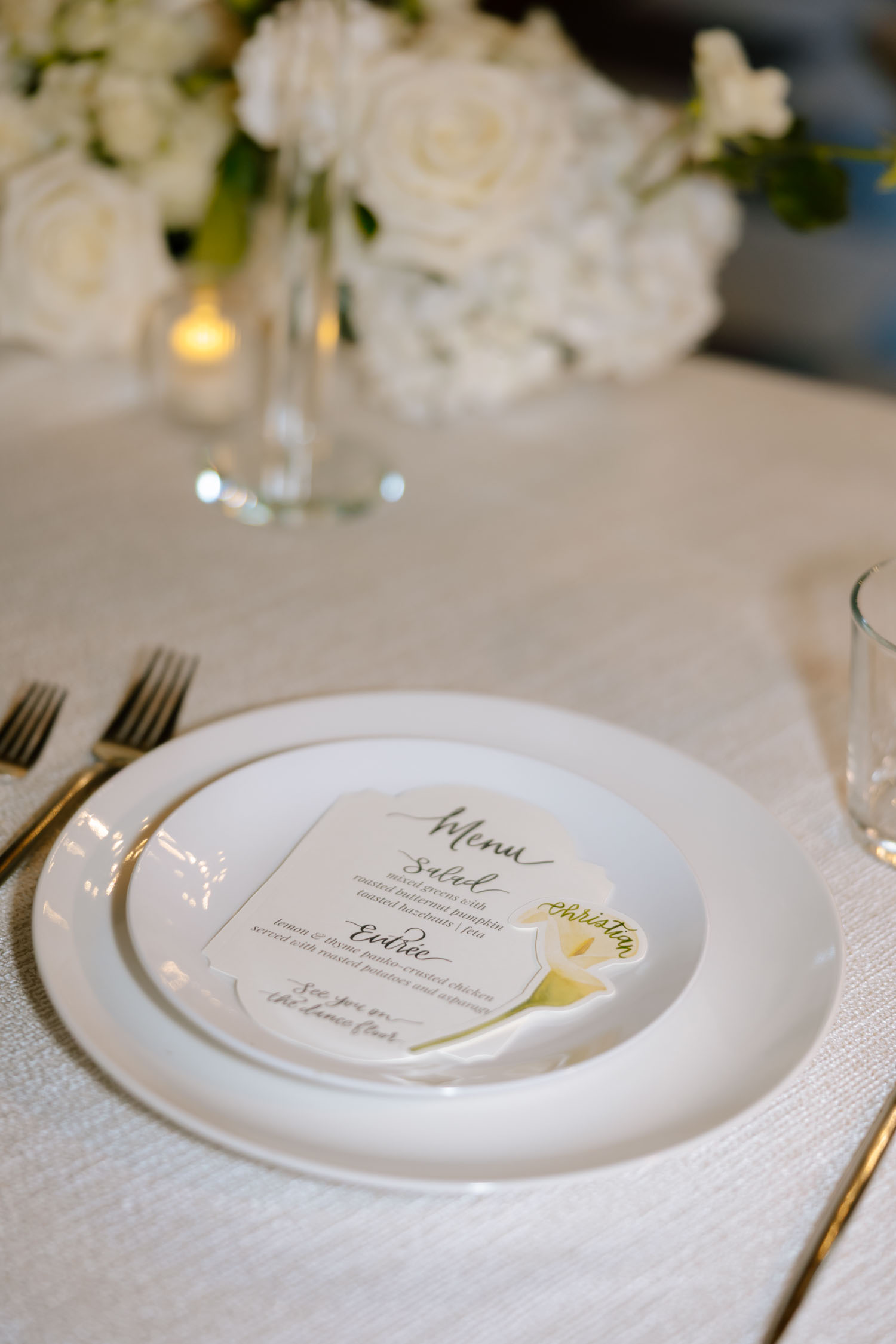 Elegant white menus and calla lily place cards for editorial wedding in New College in Sarasota.