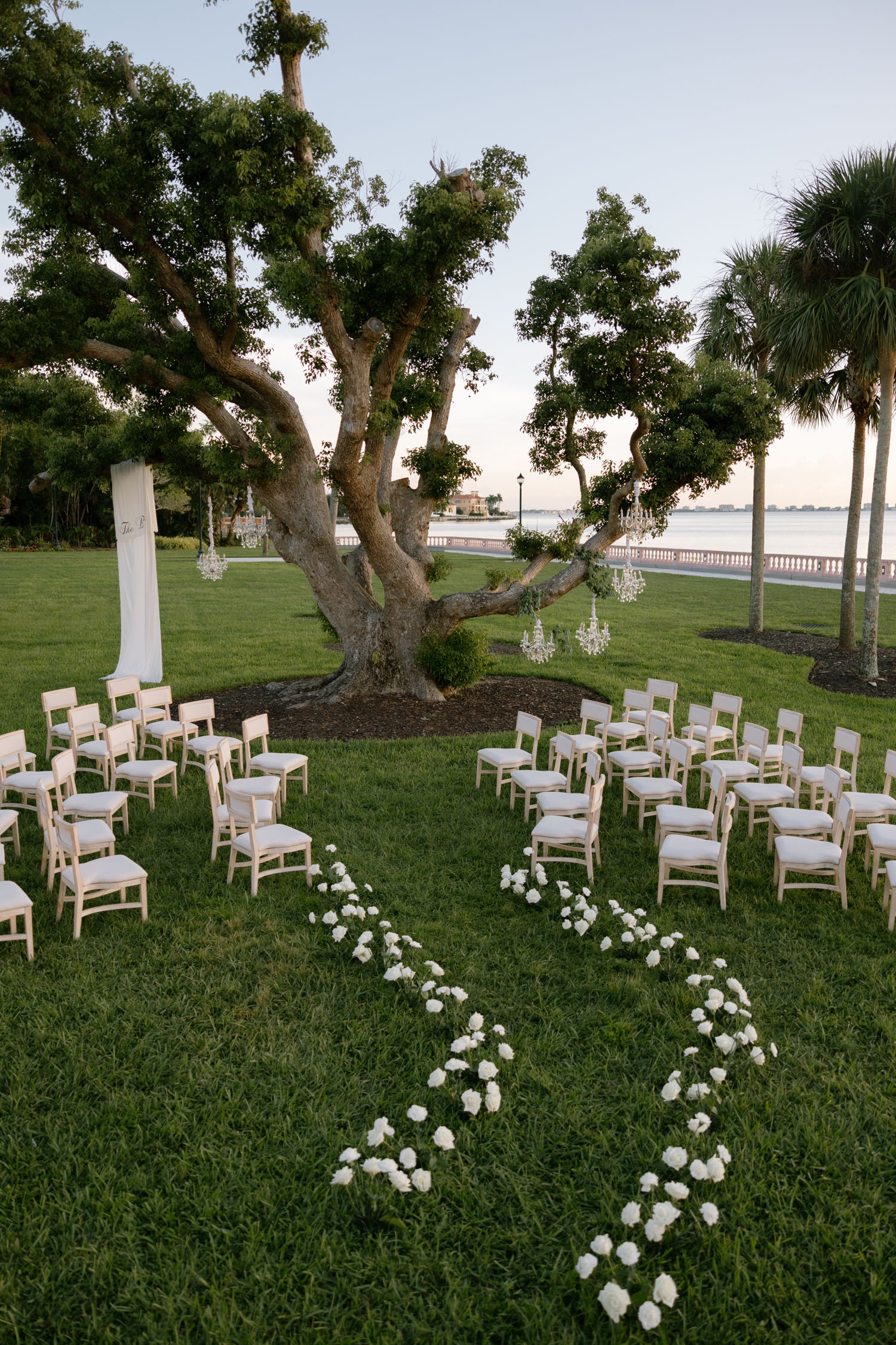 Elegant white floral wedding ceremony at New College in Sarasota, Florida