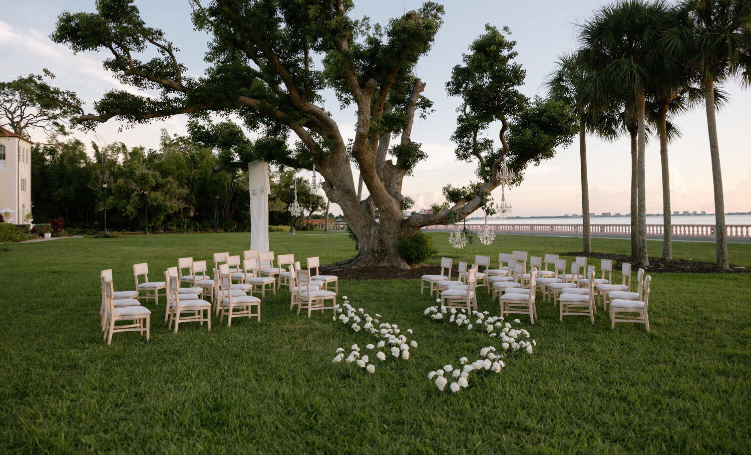 Elegant white floral wedding ceremony at New College in Sarasota, Florida