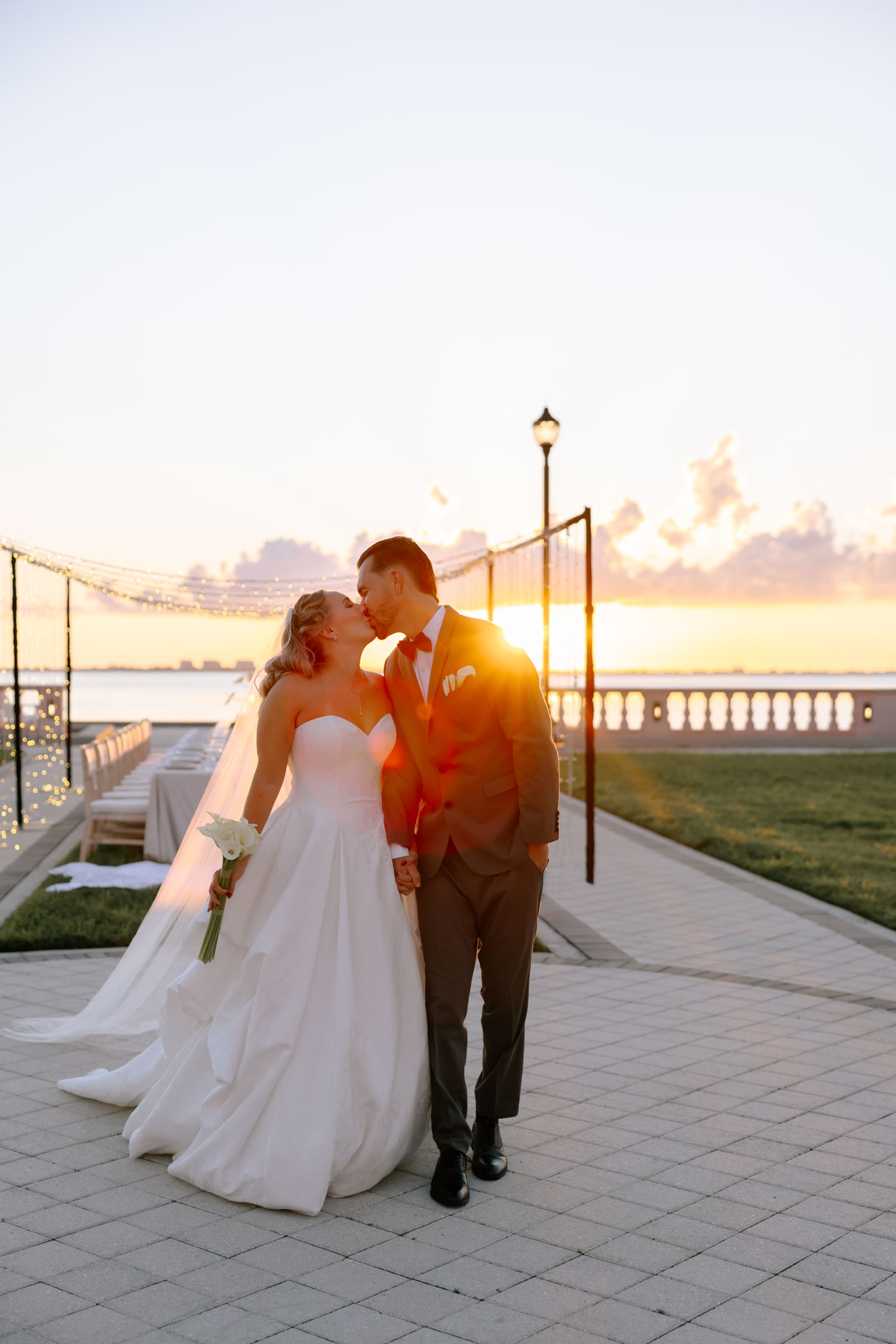 Romantic sunset wedding portraits overlooking the Gulf Coast in Sarasota, Florida